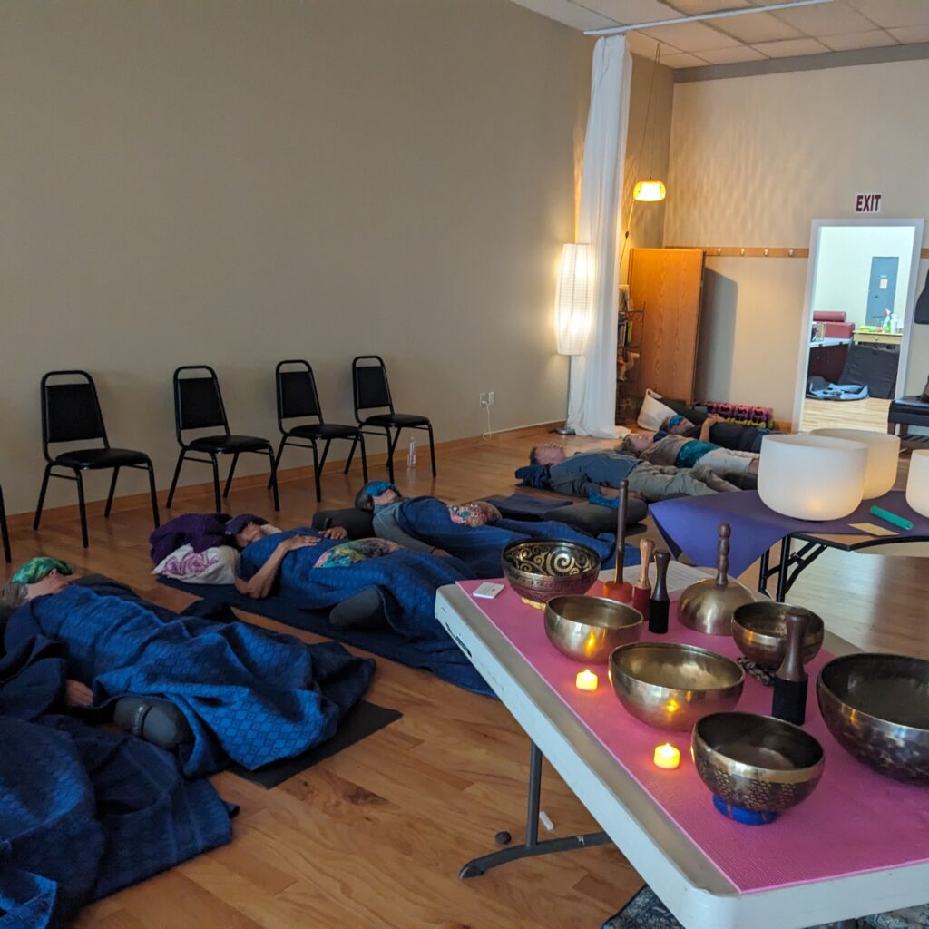Sound healing therapy with Lara sound bath journey at a meditation retreat.
