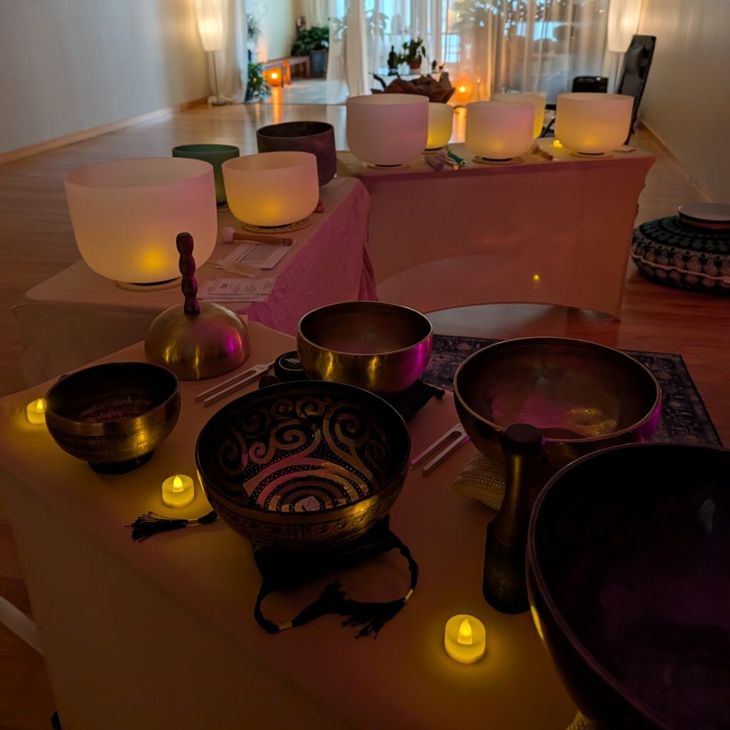 Crystal singing bowls and Tibetan singing bowls arranged for a sound healing session — vibrational sound therapy with Lara Dunning in Anacortes WA